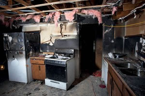 Charred kitchen in a house gutted by fire